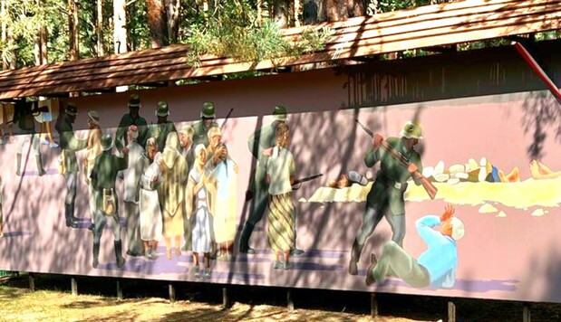 Mural pokazujący mord dokonany na mieszkańcach wsi
